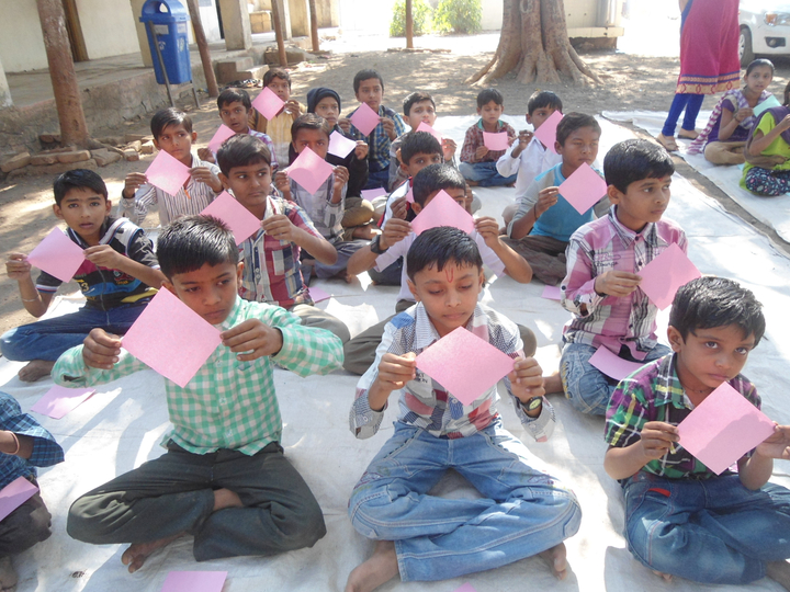 boys holding squares