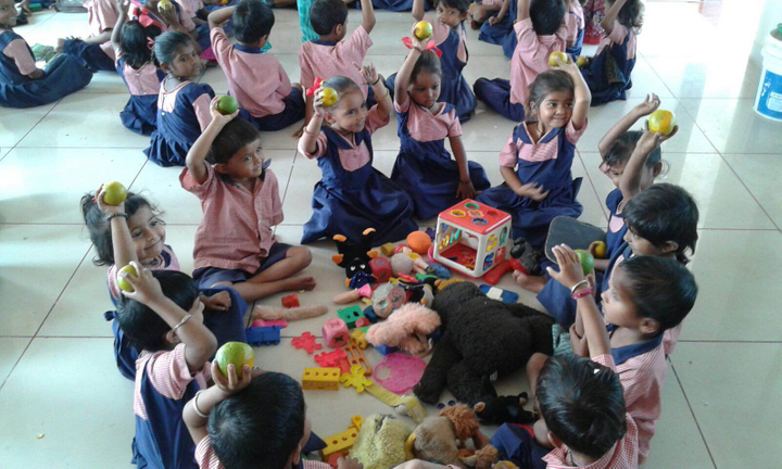children holding oranges